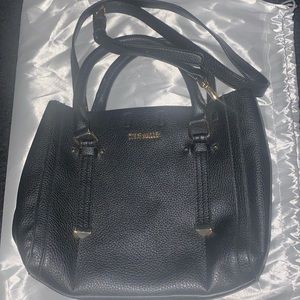Steve Madden black medium shoulder/ hand purse. Pre owned no call outs